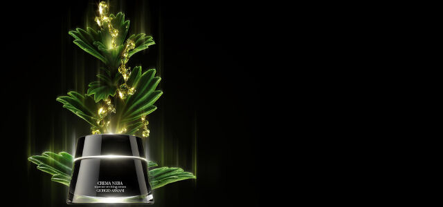 A sleek black jar of cream is prominently displayed on a textured red background, surrounded by golden beads that create an artistic, mountainous appearance.