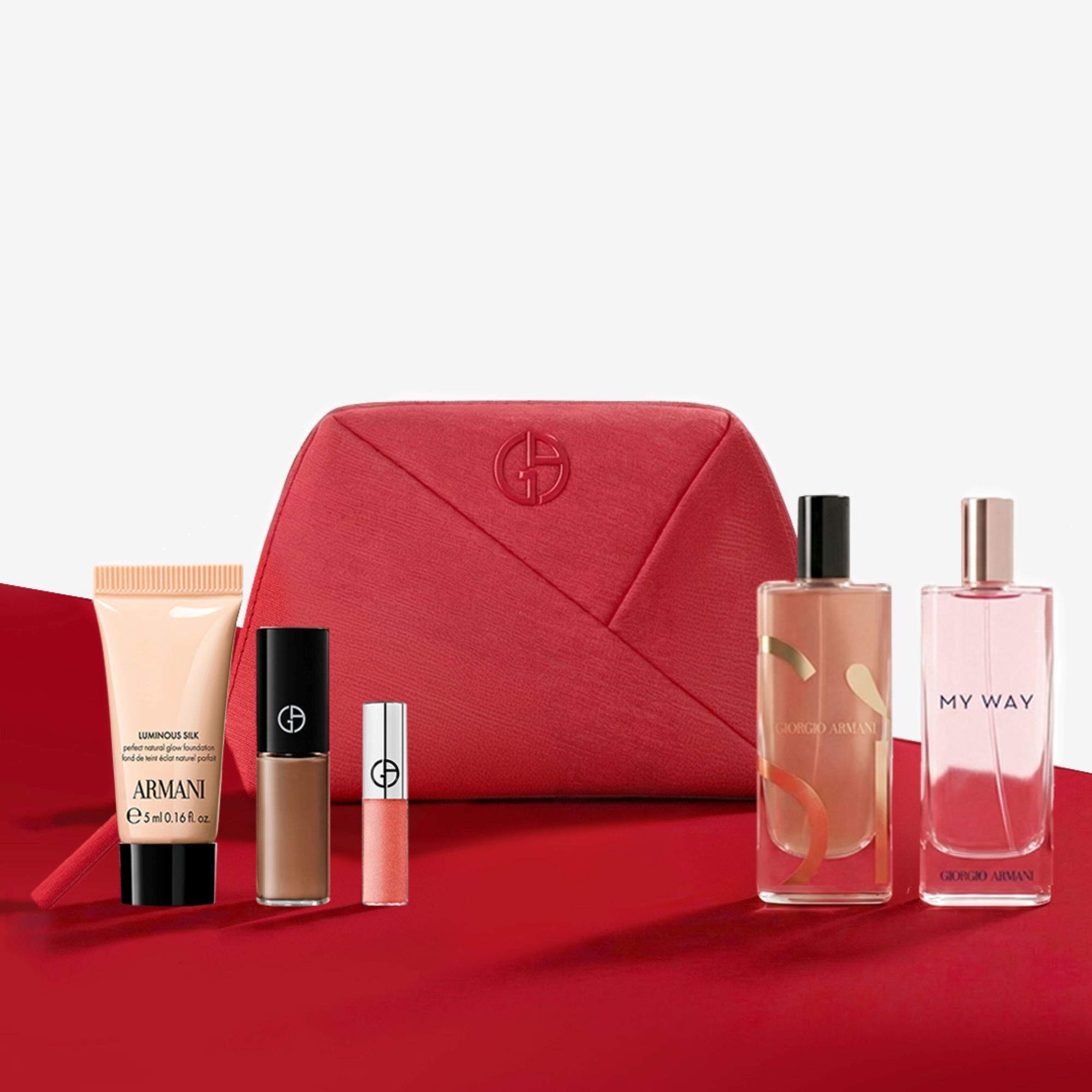 Coffret beaute Giorgio Armani avec une trousse rouge, des parfums et du maquillage.