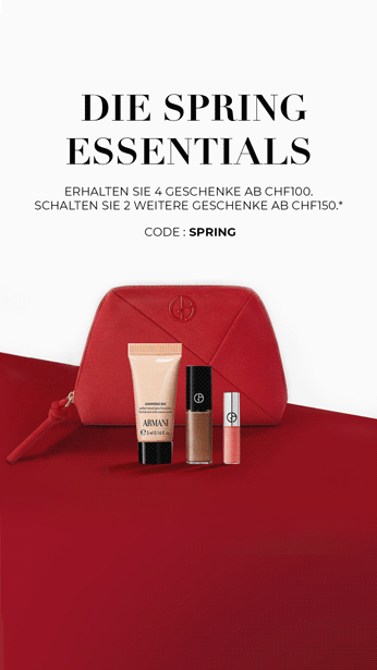 Armani Code Elixir fragrance bottle on a black leather background.