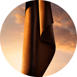 Deep leather drape against a warm amber sky — lavender essence heart note of I Will Eau de Parfum by Giorgio Armani.