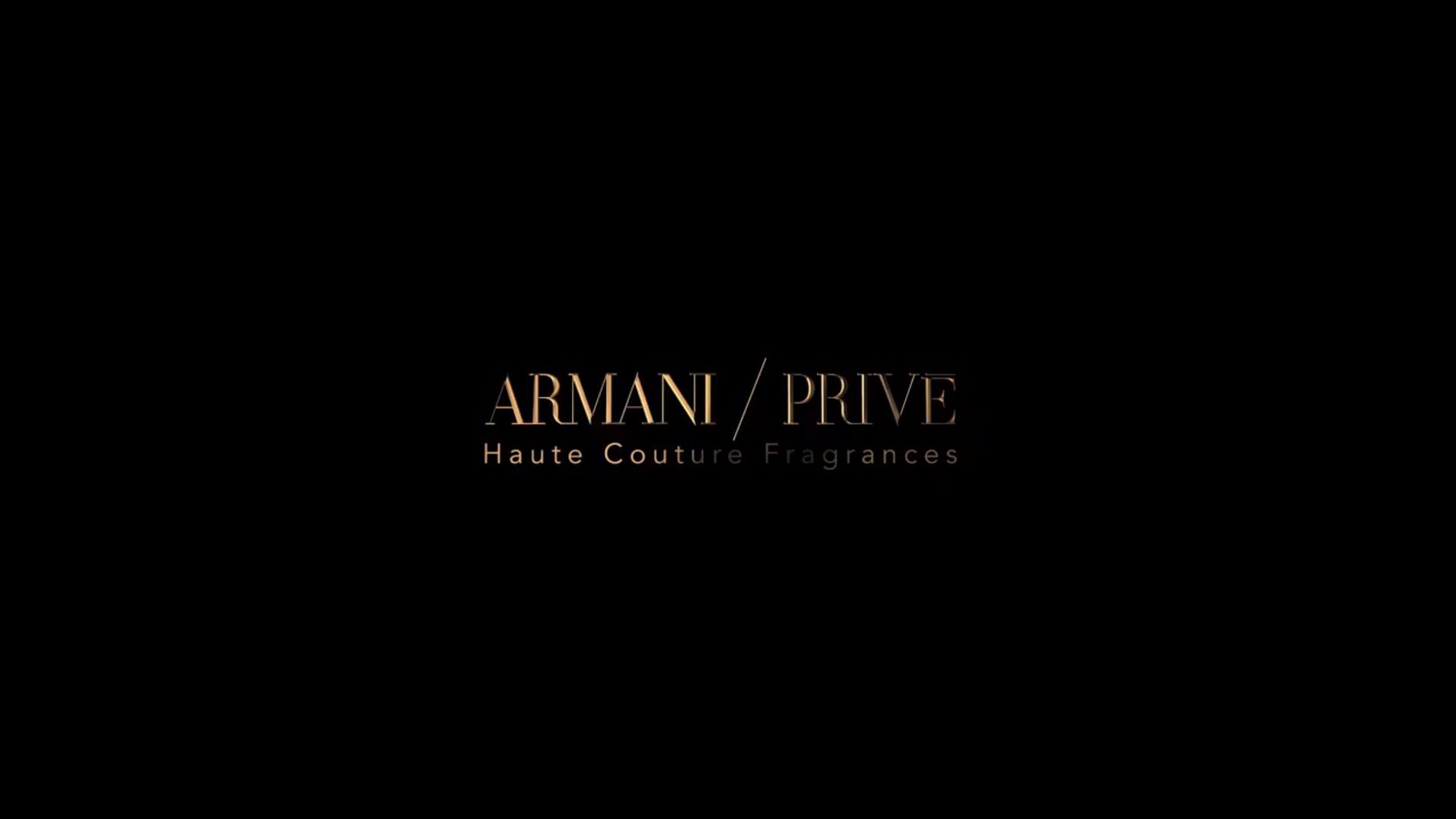 Logo von Armani Privé für Haute Couture Düfte auf schwarzem Hintergrund. Elegantes Design in goldener Schrift.